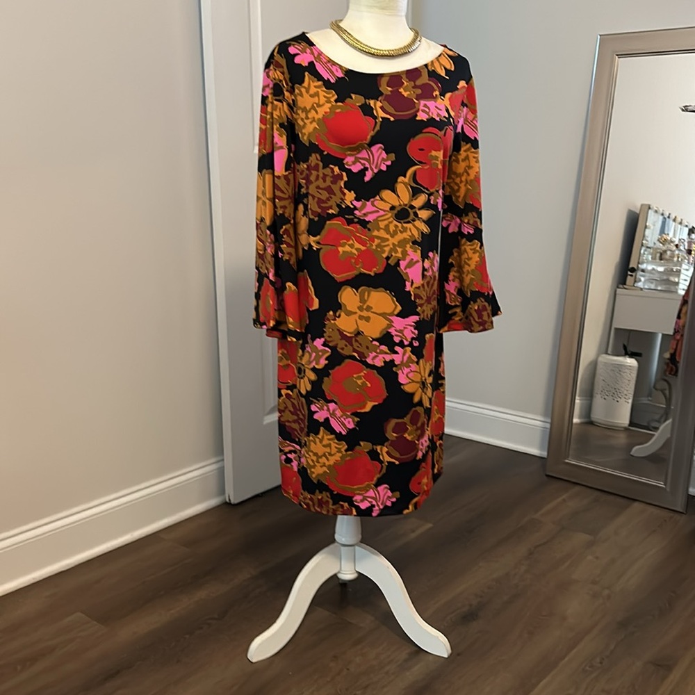 Julie Brown, that dress is beautiful, size L. Brand New with tags.